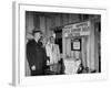 Eastern Airline Representative Eddie Rickenbacker Reading a Sign at His Companies Airport-null-Framed Photographic Print