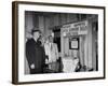 Eastern Airline Representative Eddie Rickenbacker Reading a Sign at His Companies Airport-null-Framed Photographic Print