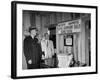Eastern Airline Representative Eddie Rickenbacker Reading a Sign at His Companies Airport-null-Framed Photographic Print