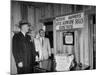 Eastern Airline Representative Eddie Rickenbacker Reading a Sign at His Companies Airport-null-Mounted Photographic Print