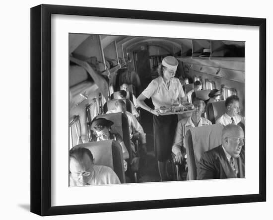 Eastern Airline Travelers Receiving a Mid-Flight Meal from a Female Steward-null-Framed Photographic Print