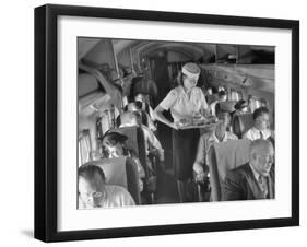 Eastern Airline Travelers Receiving a Mid-Flight Meal from a Female Steward-null-Framed Photographic Print
