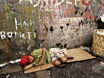 An Indonesian Boy Wearing a Spiderman Mask Sleeps on a Piece of Cardboard-Ed Wray-Photographic Print