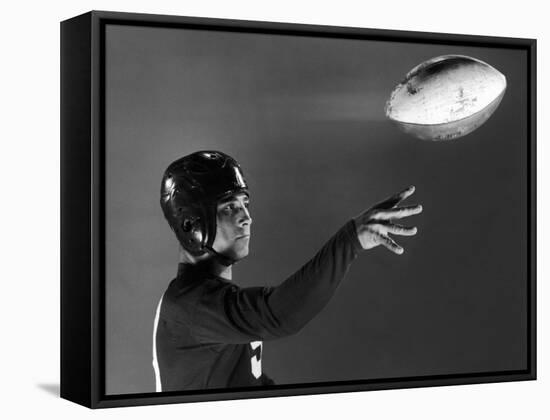 Eddie Miller of NY Giants Demonstrates Spiral Pass by Gripping Ball Along Lacing Close to the Ear-Gjon Mili-Framed Stretched Canvas