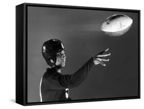 Eddie Miller of NY Giants Demonstrates Spiral Pass by Gripping Ball Along Lacing Close to the Ear-Gjon Mili-Framed Stretched Canvas