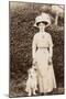 Edwardian Woman with a Terrier in a Garden-null-Mounted Photographic Print