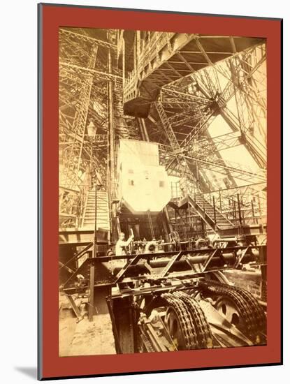 Eiffel Tower Machinery with a Man Beside the Wheel That Raises Elevator-null-Mounted Giclee Print