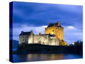 Eilean Donan Castle Floodlit Against Deep Blue Twilight Sky and Water of Loch Duich, Near Dornie, K-Lee Frost-Stretched Canvas