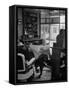 Elderly Barber Sitting Reading the Morning Paper in Small Village Shop in Small New England Town-Yale Joel-Framed Stretched Canvas