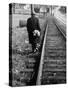 Elderly Hobo, with Bundle Strapped to His Back, Walking Along Train Tracks-Carl Mydans-Stretched Canvas