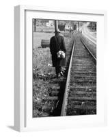 Elderly Hobo, with Bundle Strapped to His Back, Walking Along Train Tracks-Carl Mydans-Framed Photographic Print