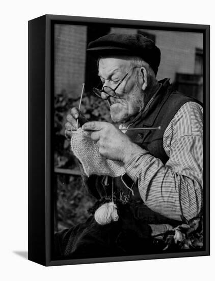 Elderly Man Knitting Garments During Drive to Provide Goods to Servicemen During the War-null-Framed Stretched Canvas