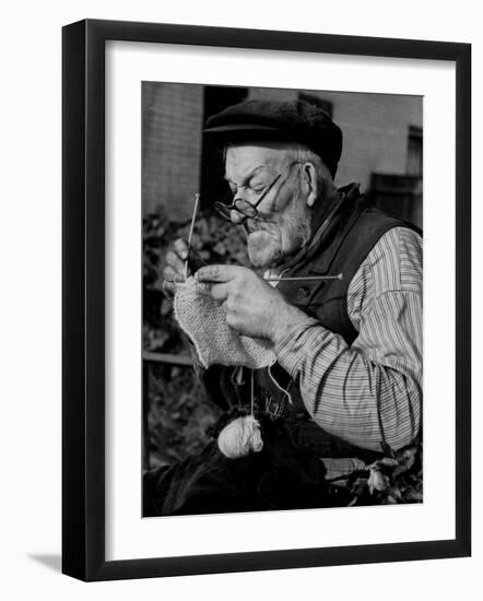 Elderly Man Knitting Garments During Drive to Provide Goods to Servicemen During the War-null-Framed Premium Photographic Print