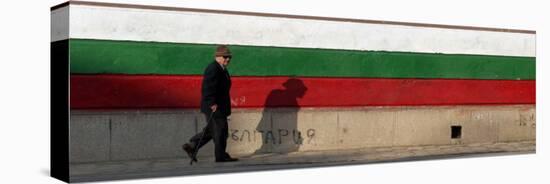Elderly Man Passes a National Flag Painted on Front of a Polling Station in Bulgarian Capital Sofia-null-Stretched Canvas