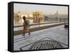 Elderly Sikh Pilgrim with Bundle and Stick Walking Around Holy Pool, Amritsar, India-Eitan Simanor-Framed Stretched Canvas