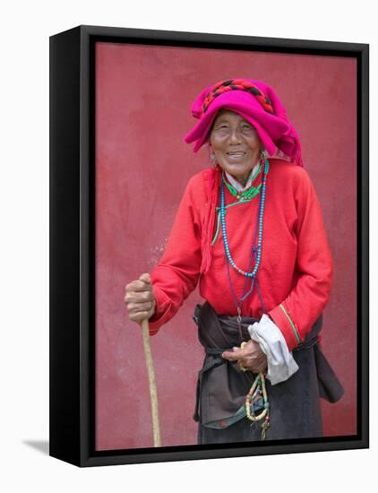 Elderly Tibetan Woman with Red Wall, Tagong, Sichuan, China-Keren Su-Framed Stretched Canvas