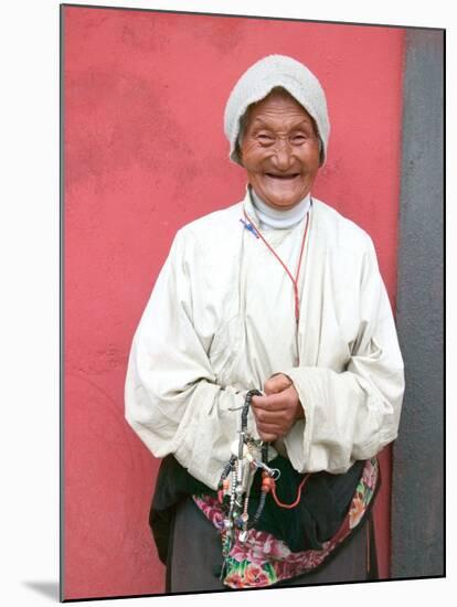 Elderly Tibetan Woman with Red Wall, Tagong, Sichuan, China-Keren Su-Mounted Premium Photographic Print