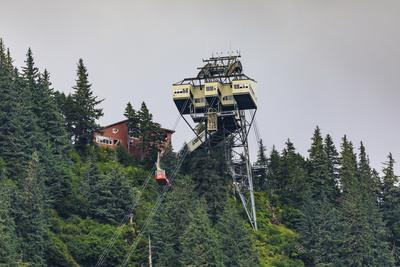 Mount Roberts Tramway cable car approaches top station, surrounded by forest, Juneau, Alaska, Unite