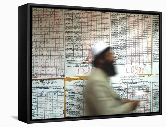 Electoral Worker Passes Election Results Posted on Wall at a Counting Center in Kabul, Afghanistan-null-Framed Stretched Canvas