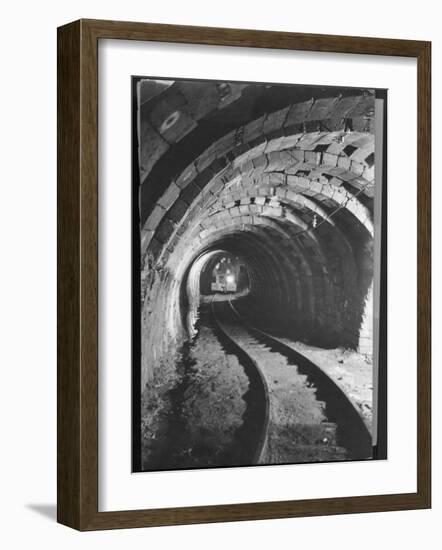 Electric Locomotive on Track in Powderly Anthracite Coal Mine Gangway, Owned by Hudson Coal Co-Margaret Bourke-White-Framed Photographic Print