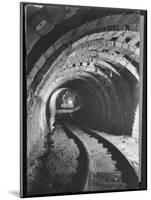 Electric Locomotive on Track in Powderly Anthracite Coal Mine Gangway, Owned by Hudson Coal Co-Margaret Bourke-White-Mounted Photographic Print