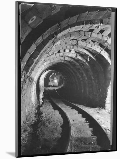 Electric Locomotive on Track in Powderly Anthracite Coal Mine Gangway, Owned by Hudson Coal Co-Margaret Bourke-White-Mounted Photographic Print