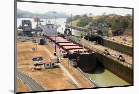 Electric mules guiding Panamax ship through Miraflores Locks on the Panama Canal, Panama, Central A-Tony Waltham-Mounted Photographic Print