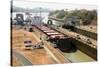 Electric mules guiding Panamax ship through Miraflores Locks on the Panama Canal, Panama, Central A-Tony Waltham-Stretched Canvas