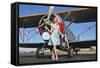 Elegant 1940's Style Pin-Up Girl Standing in Front of an F3F Biplane-null-Framed Stretched Canvas