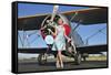 Elegant 1940's Style Pin-Up Girl Standing in Front of an F3F Biplane-null-Framed Stretched Canvas