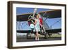 Elegant 1940's Style Pin-Up Girl Standing in Front of an F3F Biplane-null-Framed Premium Photographic Print