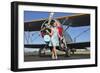 Elegant 1940's Style Pin-Up Girl Standing in Front of an F3F Biplane-null-Framed Photographic Print