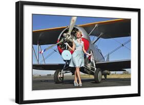 Elegant 1940's Style Pin-Up Girl Standing in Front of an F3F Biplane-null-Framed Photographic Print