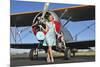 Elegant 1940's Style Pin-Up Girl Standing in Front of an F3F Biplane-null-Mounted Photographic Print