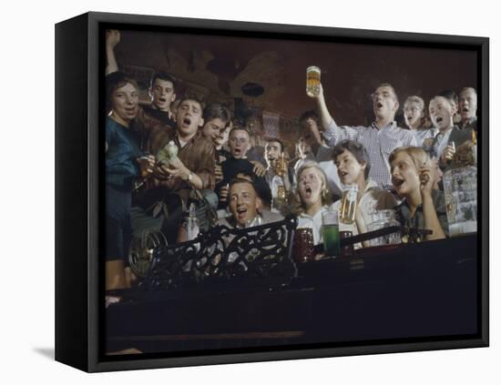 Elevated View of a Group of People as They Sing Along with a Pianist in a Unidentified Bar, 1959-Yale Joel-Framed Stretched Canvas