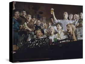 Elevated View of a Group of People as They Sing Along with a Pianist in a Unidentified Bar, 1959-Yale Joel-Stretched Canvas