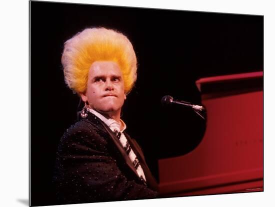 Elton John Performing, Wearing Wig-null-Mounted Premium Photographic Print