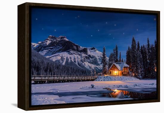 Emerald Lake Lodge in Banff, Canada during winter with snow and mountains at night with starry sky-David Chang-Framed Stretched Canvas