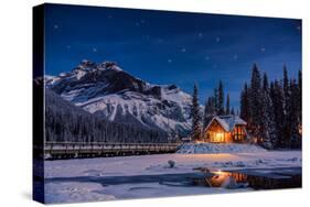 Emerald Lake Lodge in Banff, Canada during winter with snow and mountains at night with starry sky-David Chang-Stretched Canvas