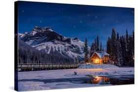 Emerald Lake Lodge in Banff, Canada during winter with snow and mountains at night with starry sky-David Chang-Stretched Canvas