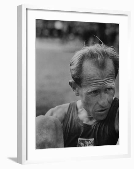 Emil Zatopek Sitting Tensely with Furrowed Brow after Winning Second of Three Olympic Races-Ralph Crane-Framed Premium Photographic Print