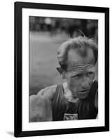 Emil Zatopek Sitting Tensely with Furrowed Brow after Winning Second of Three Olympic Races-Ralph Crane-Framed Premium Photographic Print