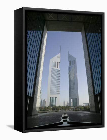 Emirates Towers Through Dubai International Financial Center Arch, Sheikh Zayed Road, Dubai, UAE-Walter Bibikow-Framed Stretched Canvas