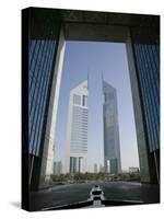 Emirates Towers Through Dubai International Financial Center Arch, Sheikh Zayed Road, Dubai, UAE-Walter Bibikow-Stretched Canvas