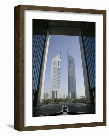 Emirates Towers Through Dubai International Financial Center Arch, Sheikh Zayed Road, Dubai, UAE-Walter Bibikow-Framed Photographic Print