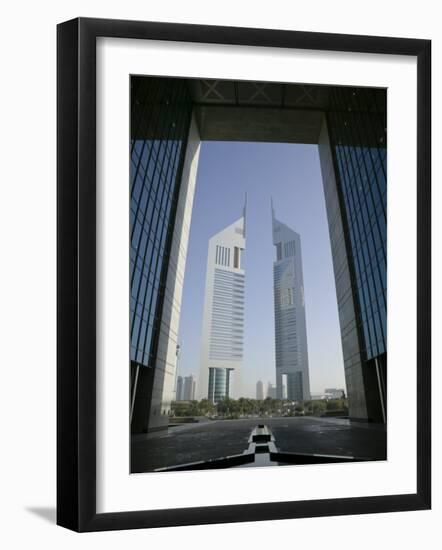 Emirates Towers Through Dubai International Financial Center Arch, Sheikh Zayed Road, Dubai, UAE-Walter Bibikow-Framed Photographic Print