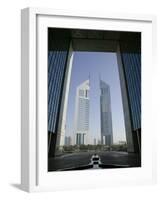 Emirates Towers Through Dubai International Financial Center Arch, Sheikh Zayed Road, Dubai, UAE-Walter Bibikow-Framed Photographic Print