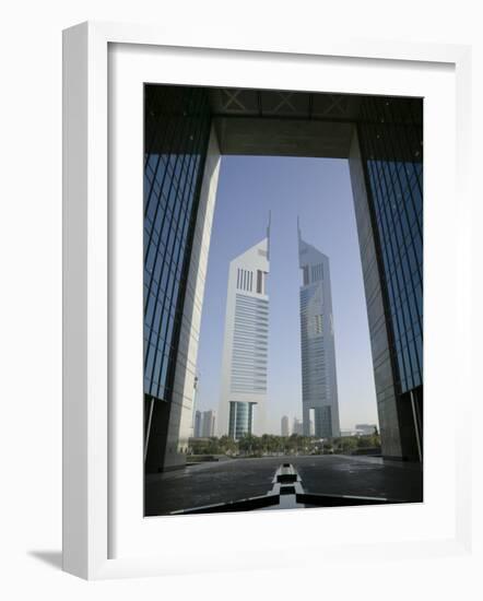 Emirates Towers Through Dubai International Financial Center Arch, Sheikh Zayed Road, Dubai, UAE-Walter Bibikow-Framed Photographic Print