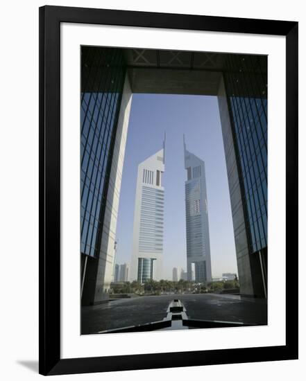 Emirates Towers Through Dubai International Financial Center Arch, Sheikh Zayed Road, Dubai, UAE-Walter Bibikow-Framed Photographic Print