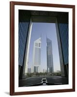 Emirates Towers Through Dubai International Financial Center Arch, Sheikh Zayed Road, Dubai, UAE-Walter Bibikow-Framed Photographic Print